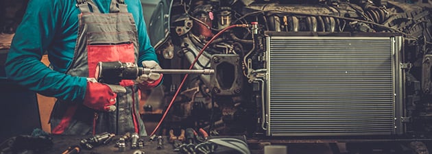 Mechanic Using a Pneumatic Air Drill